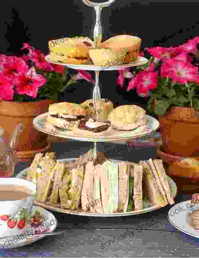 A Delicious Spread Of Afternoon Tea, Featuring Tea, Pastries, And Sandwiches COME WITH ME TO ENGLAND