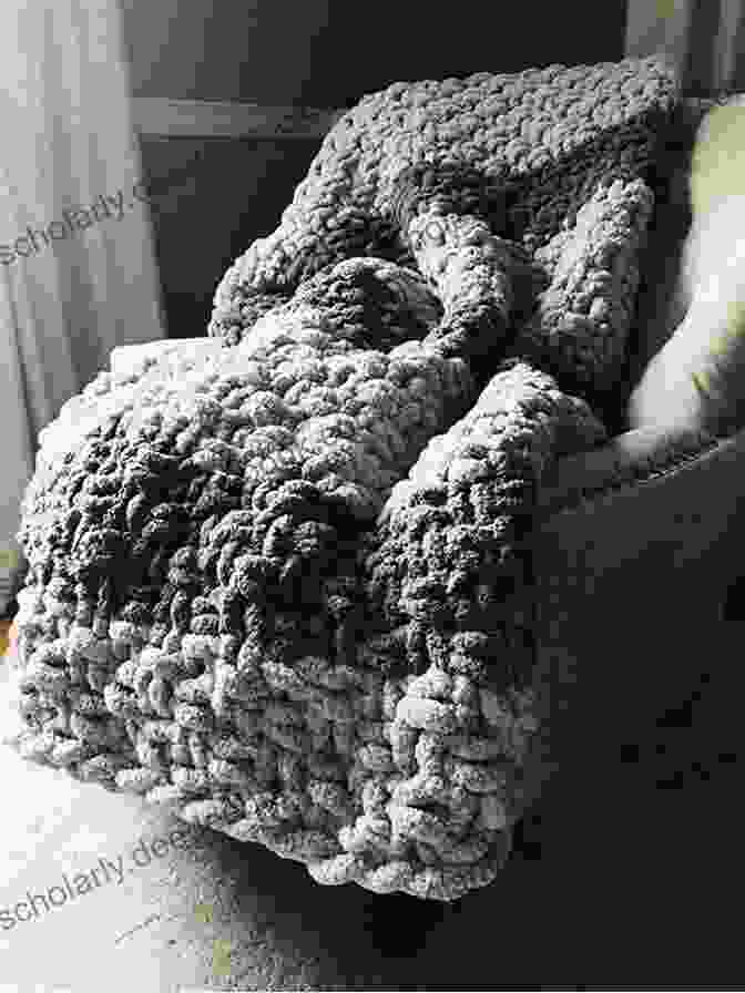 A Soft And Cozy Knitted Blanket In Neutral Colors Mollie Makes: 13 Projects To Boost Your Creativity